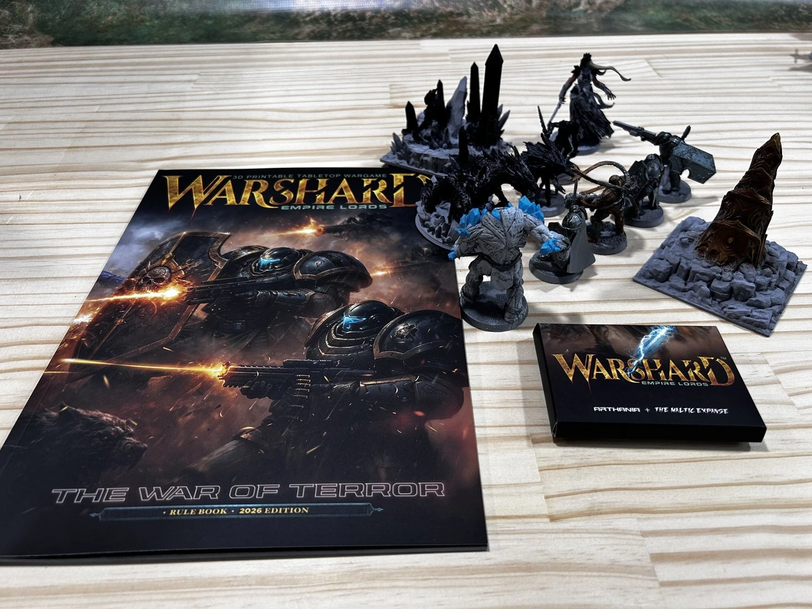 Warshard rulebook with cards and miniatures