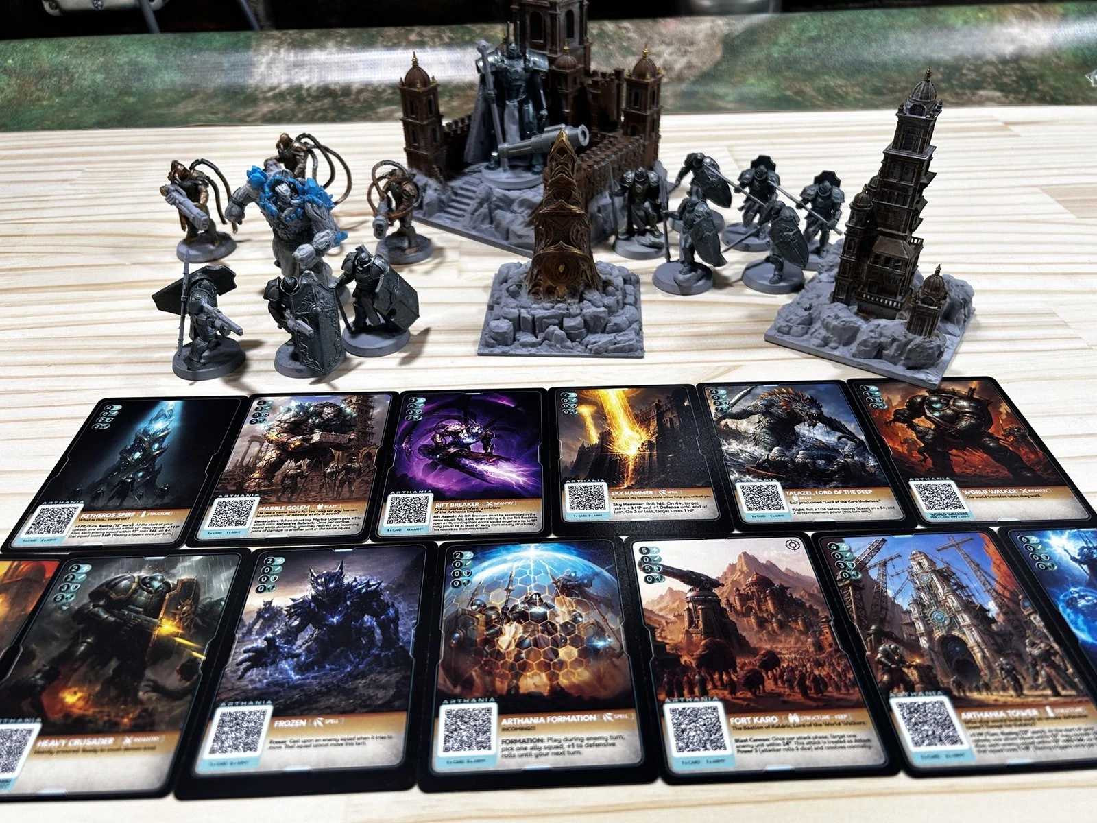 Warshard miniatures and cards arranged for gameplay